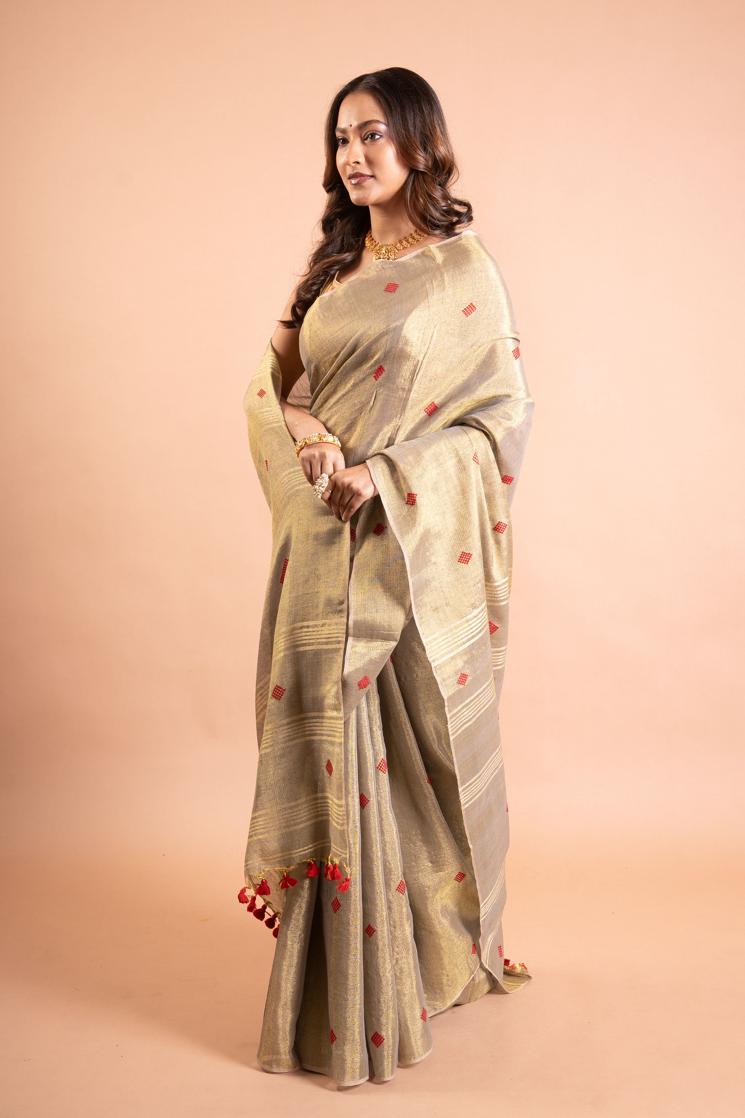 Champagne Gold Linen Tissue Saree with Red Butti & Tassels