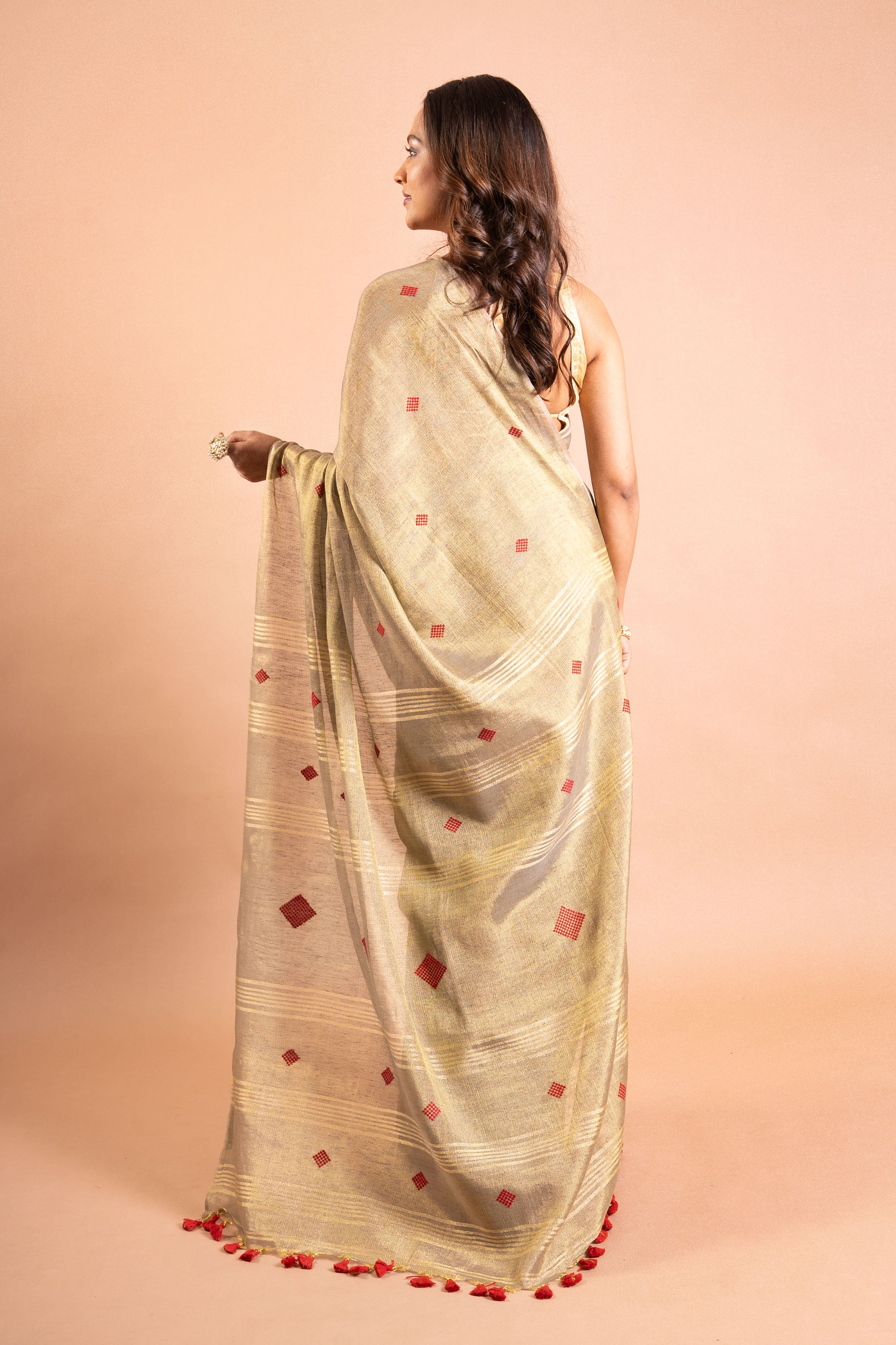 Champagne Gold Linen Tissue Saree with Red Butti & Tassels